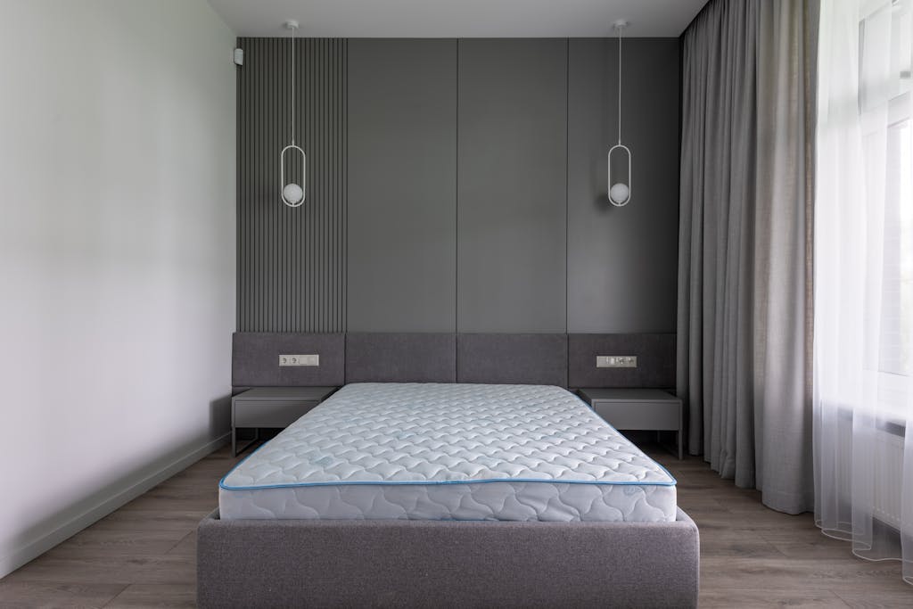 Freshly cleaned mattress in a Chicago bedroom, showcasing a spotless and rejuvenated surface with bright, crisp bedding and a serene urban view in the background.